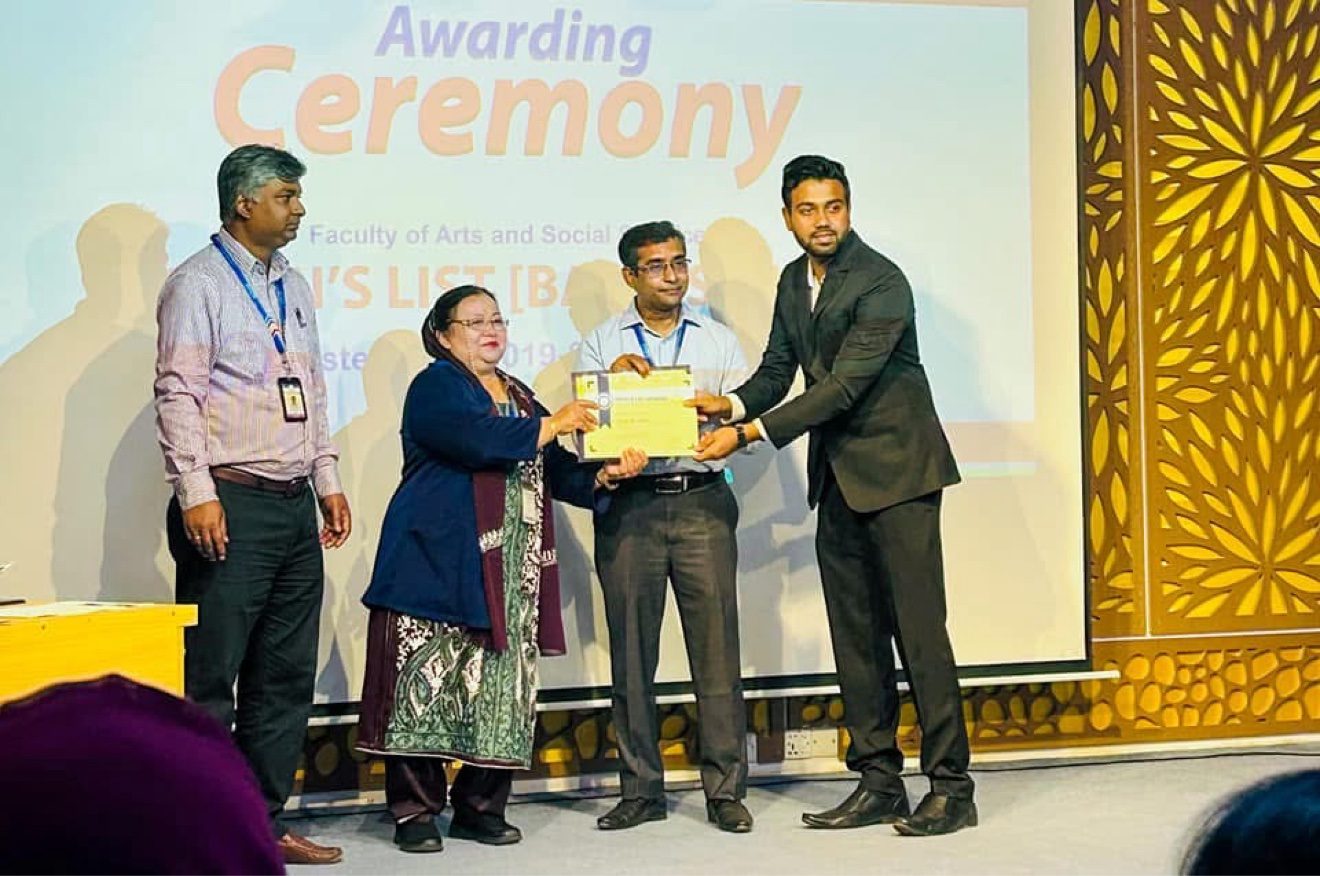 Toukir Islam receiving his AIUB Dean's List award on stage