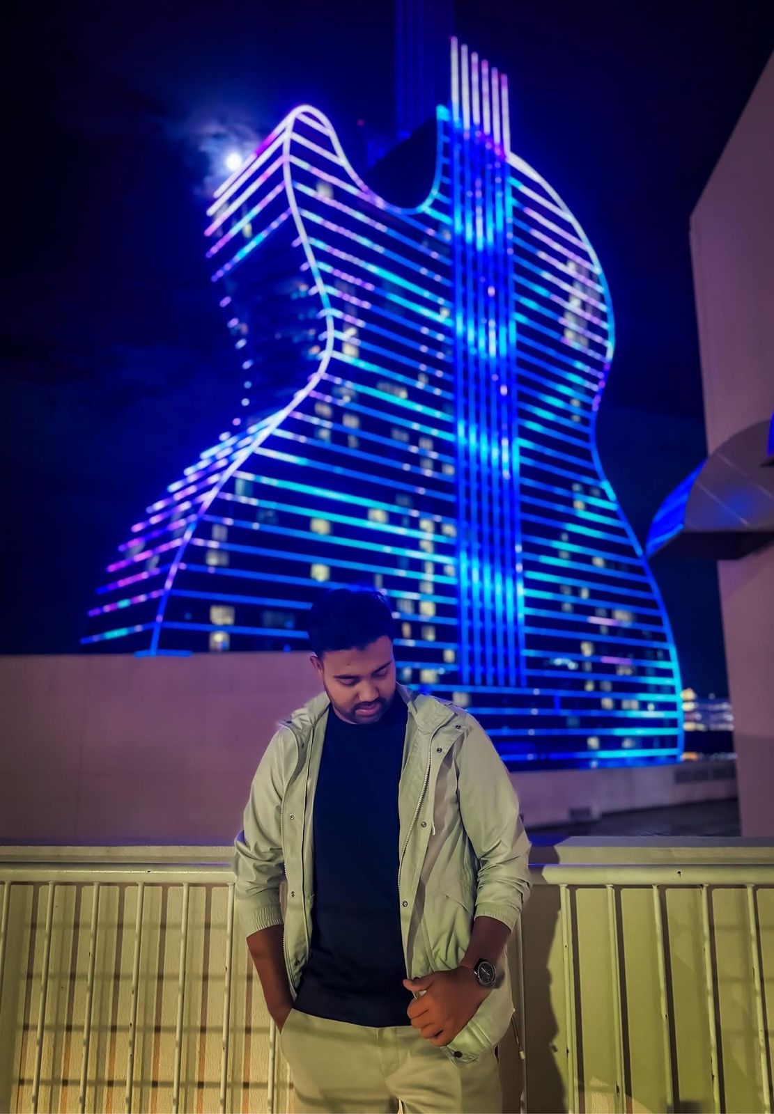 Toukir Islam in front of the Seminole Hard Rock guitar hotel in Florida